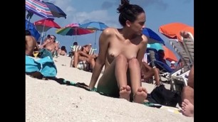 Beautiful Latina showing her pussy on nude beach