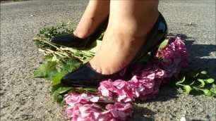 Wife crush flowers in black pointy heels