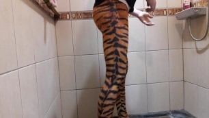 Under shower with tiger print leggings