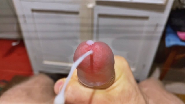 Cumming in close-up with a massive portion of cum in slow motion. Big Uncut Veiny Cock. Pissing